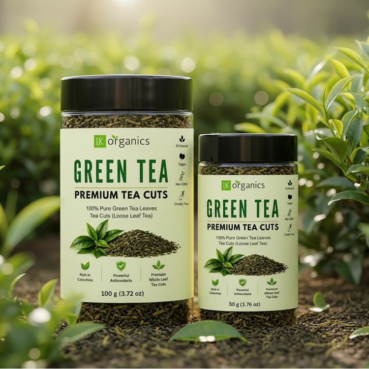 Two jars of IK Organics Premium Tea Cuts green tea, one 100g and one 50g, displayed on a warm beige background.