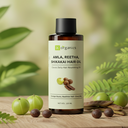 Bottle of Amla, Reetha, Shikakai Hair Oil with branding on a natural background