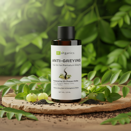 Bottle of IK Organics Anti-Greying Hair Oil on a natural background