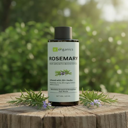 Rosemary hair growth booster oil bottle with IK Organics branding on a natural background